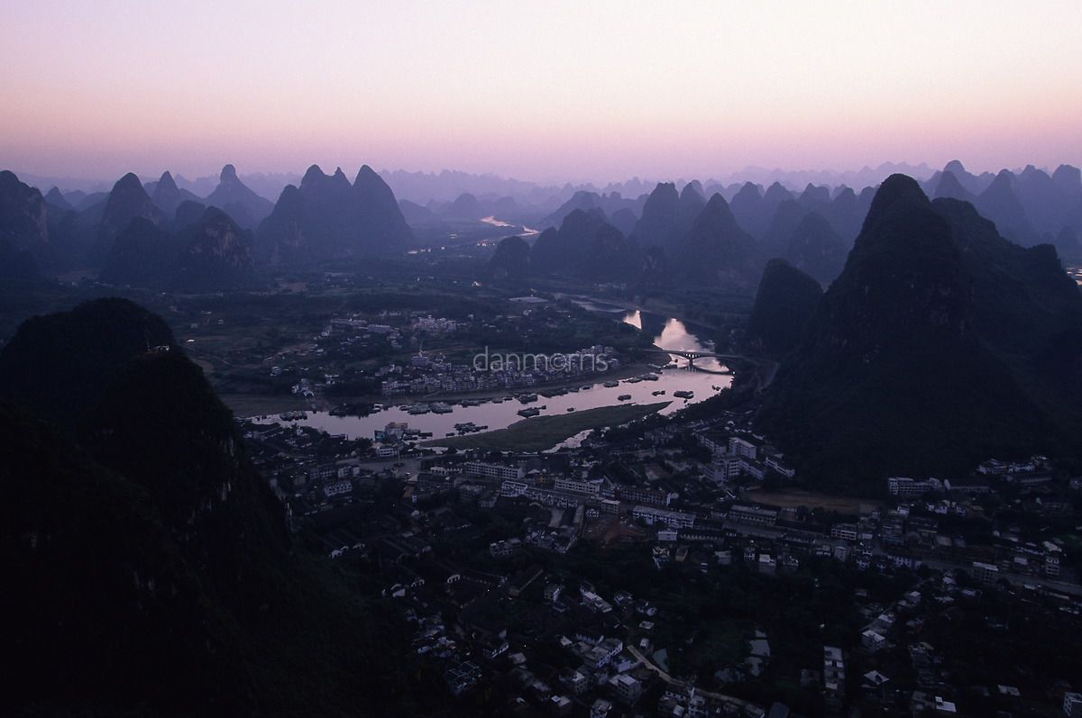 Yangshuo Sunrise Early morning light over landscape of Yangshuo and myriad karst towers, Yangshuo, Guilin, China (Dan Morris)